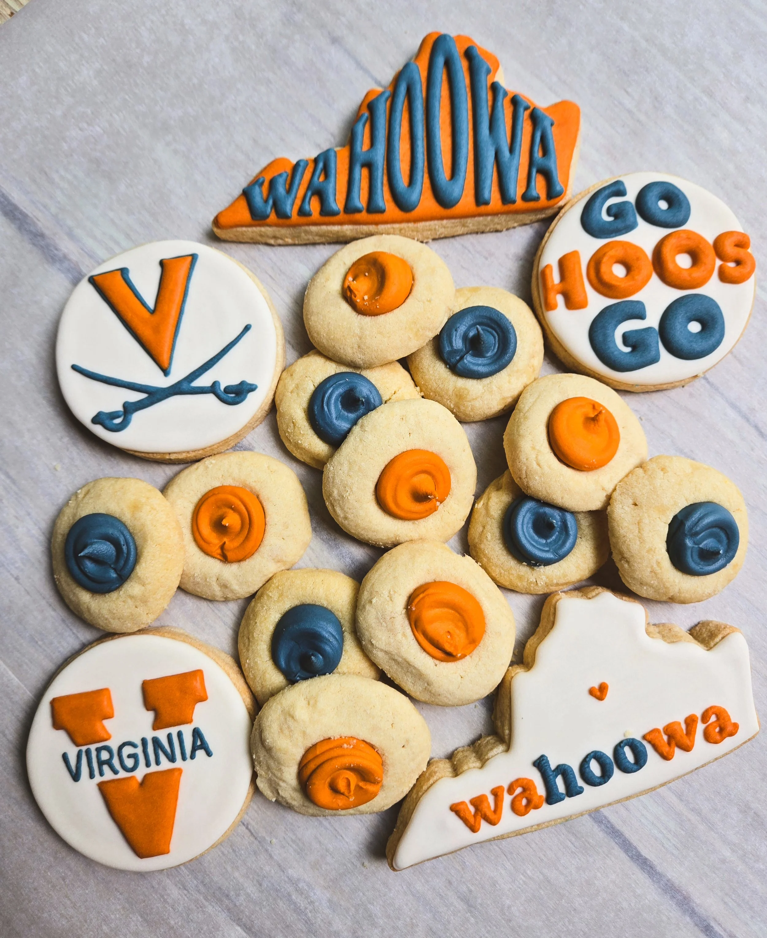 UVA Student Package - 
Give your Hoo a sweet start to the school year with a delivery of freshly baked cookies!
Choose from one of three combinations:

3 decorated cookies + 1 dozen thumbprint cookies  - 

3 decorated cookies + 1/2 dozen chocolate ch