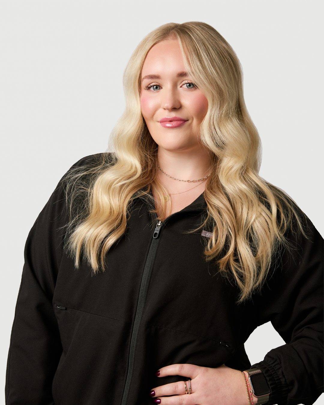 Woman in black scrubs.