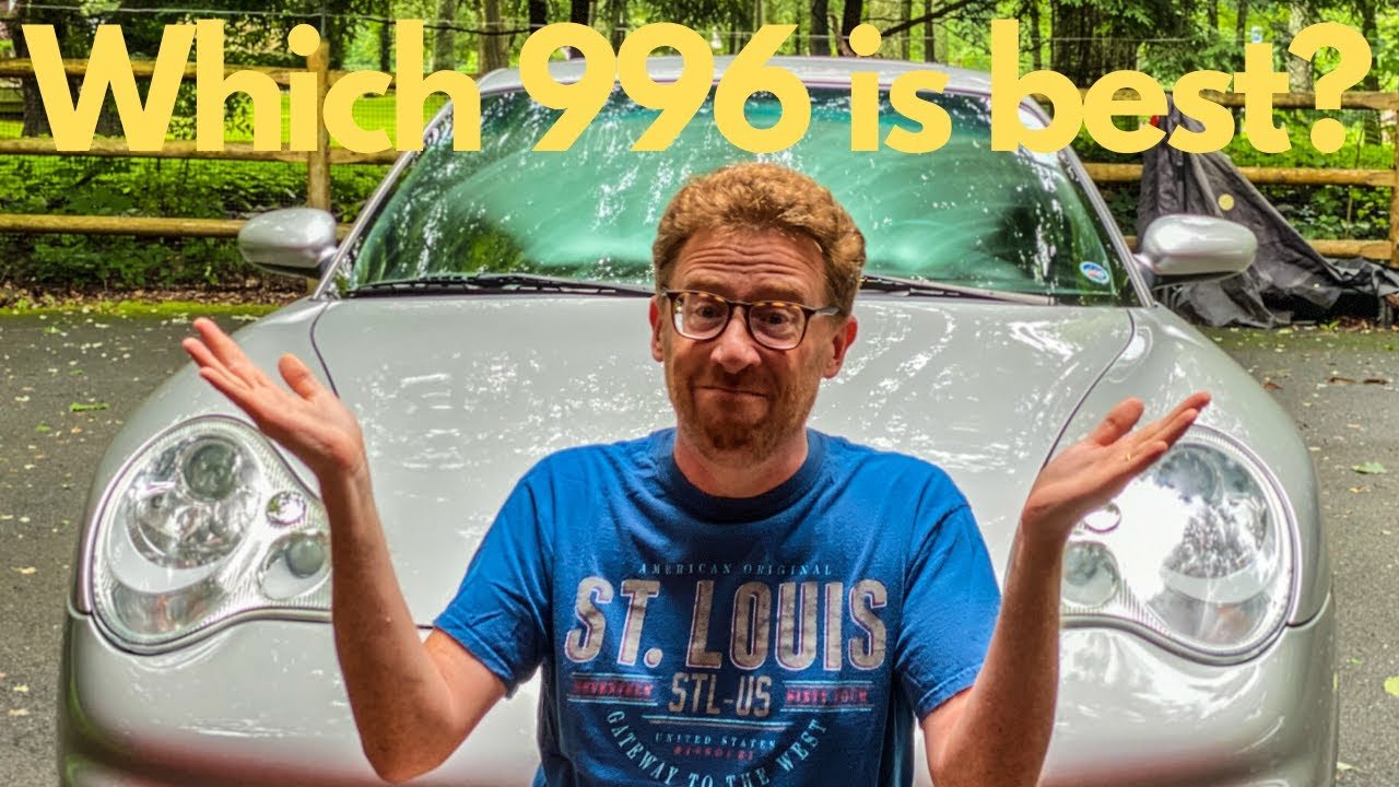 A man with glasses and a beard wearing a blue t-shirt is standing in front of a silver car, with trees and a wooden fence in the background. The text over the image asks, "Which 996 is best?"