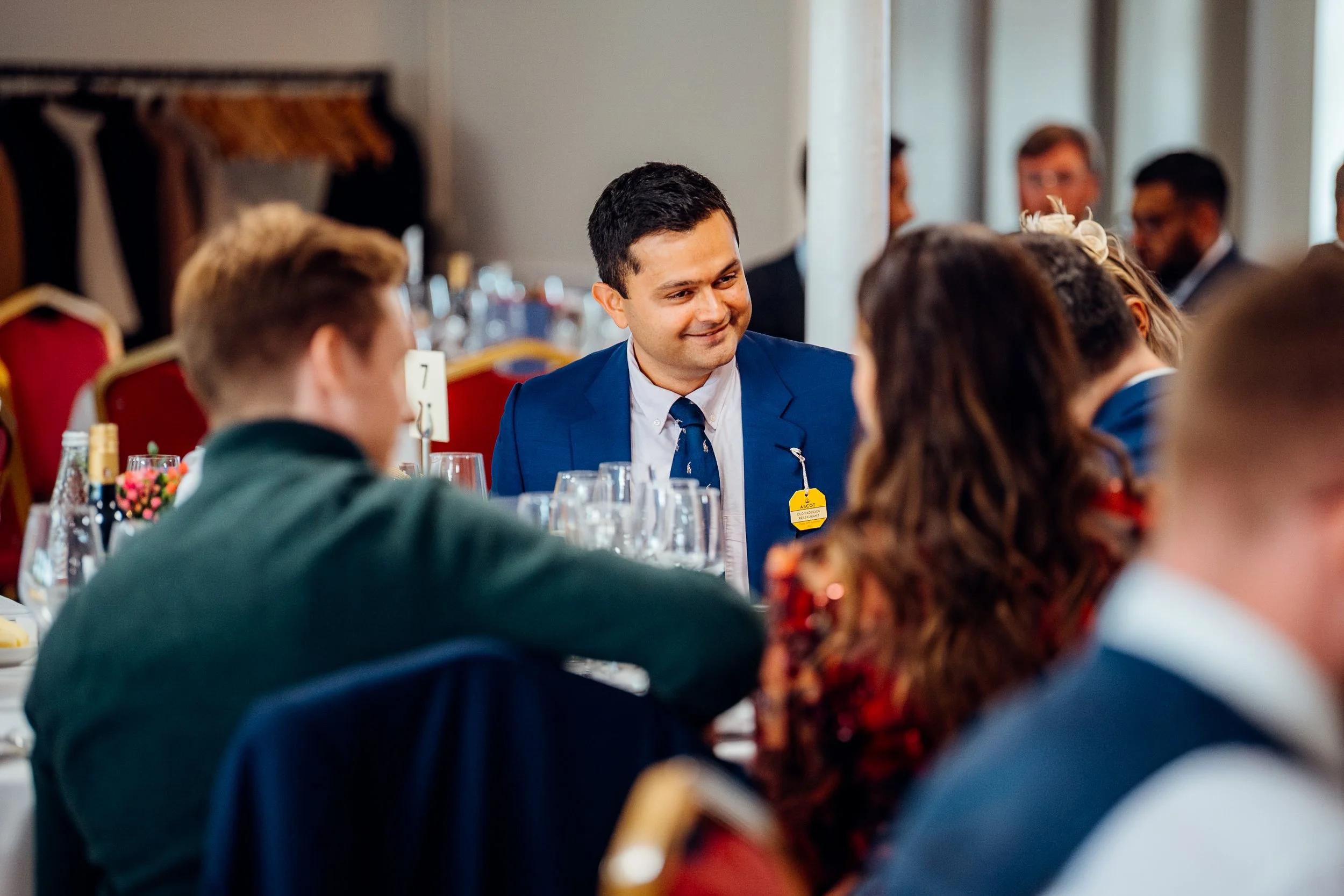 Corporate delegates networking over dinner at the GetGround business hospitality event at Ascot. Candid corporate dining and event photography by Will Bailey.