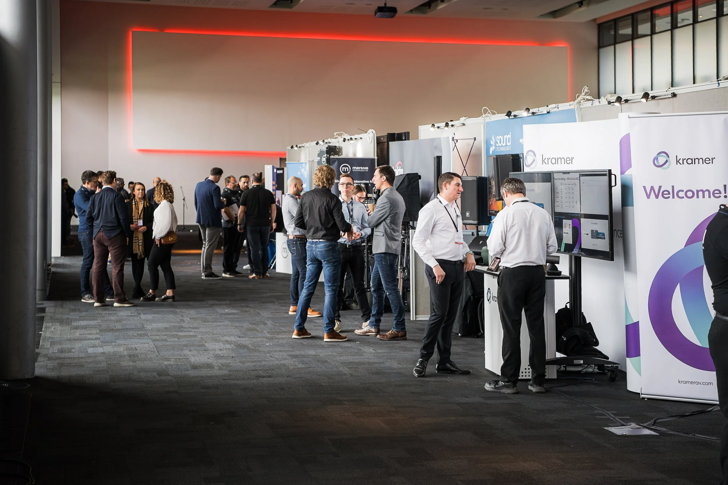 Corporate brand exhibitions and B2B networking at the Midwich Tech Xpo North, hosted at Old Trafford, Manchester. Commercial trade show and tech event photography by Will Bailey.