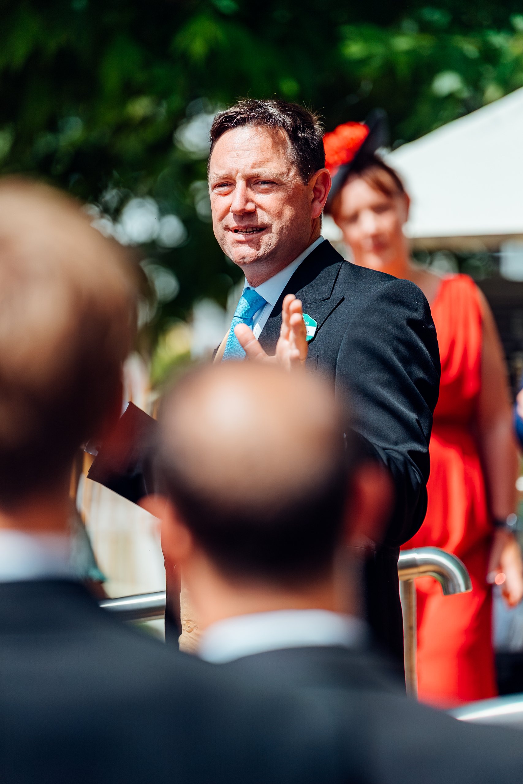 Moët & Chandon UK Managing Director Alexei Rosin greeting guests and associates at Royal Ascot. Luxury corporate hospitality photography by Will Bailey.