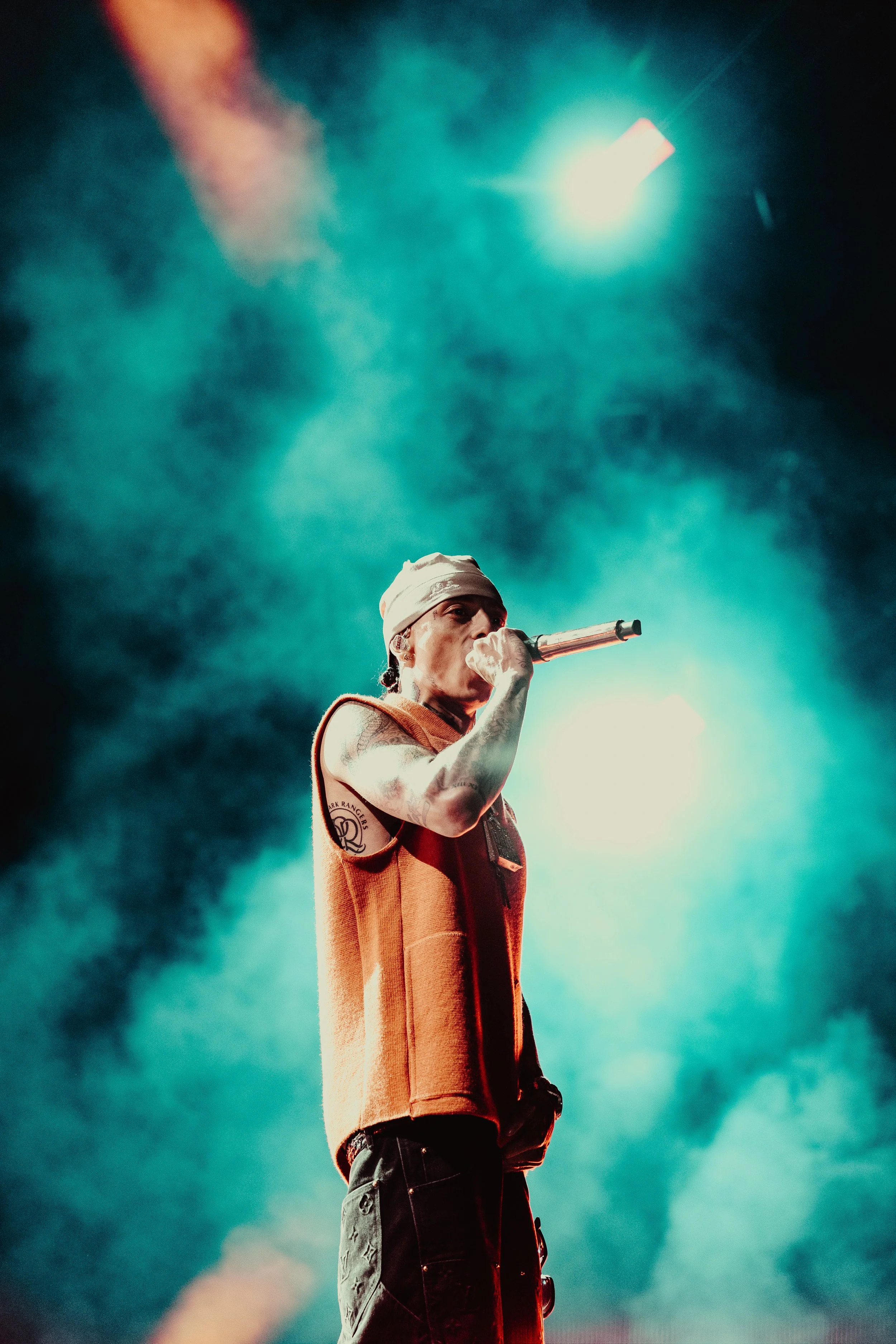 British rap icon Central Cee dominating the main stage amidst thick atmospheric haze during a major headlining performance at Boardmasters Festival in Cornwall. Large-scale music festival and commercial hip-hop concert photography by Will Bailey.