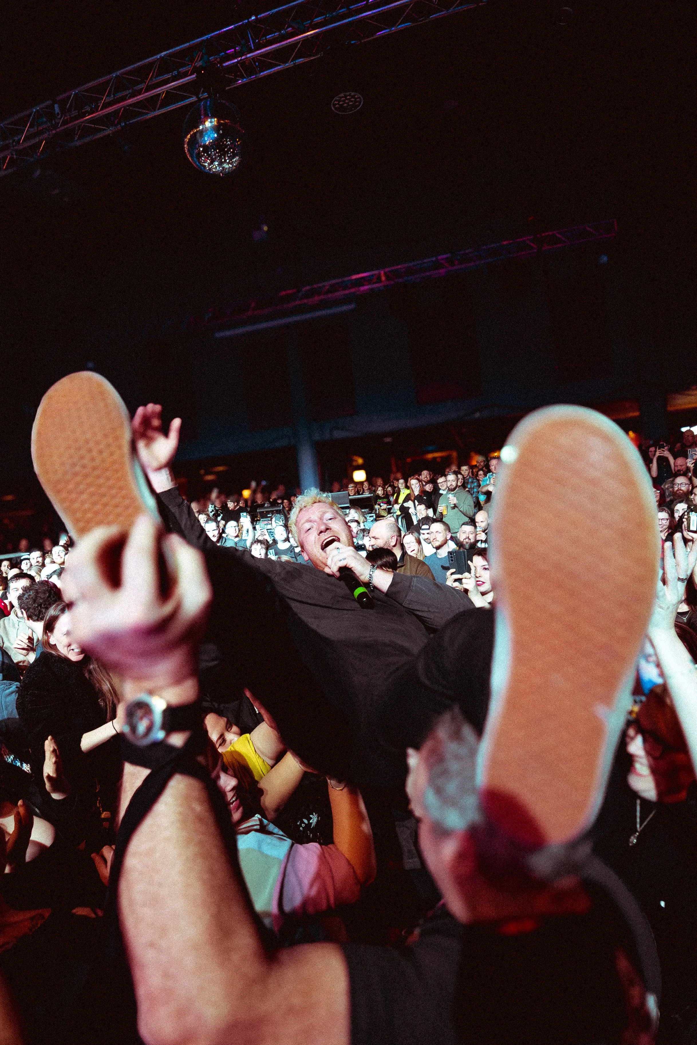 Cal Amies, the lead singer of pop-punk outfit The Bottom Line crowd-surfing flat on his back through an ecstatic audience at the O2 Academy Birmingham venue. Immersive nationwide music tour photography by official tour photographer Will Bailey.