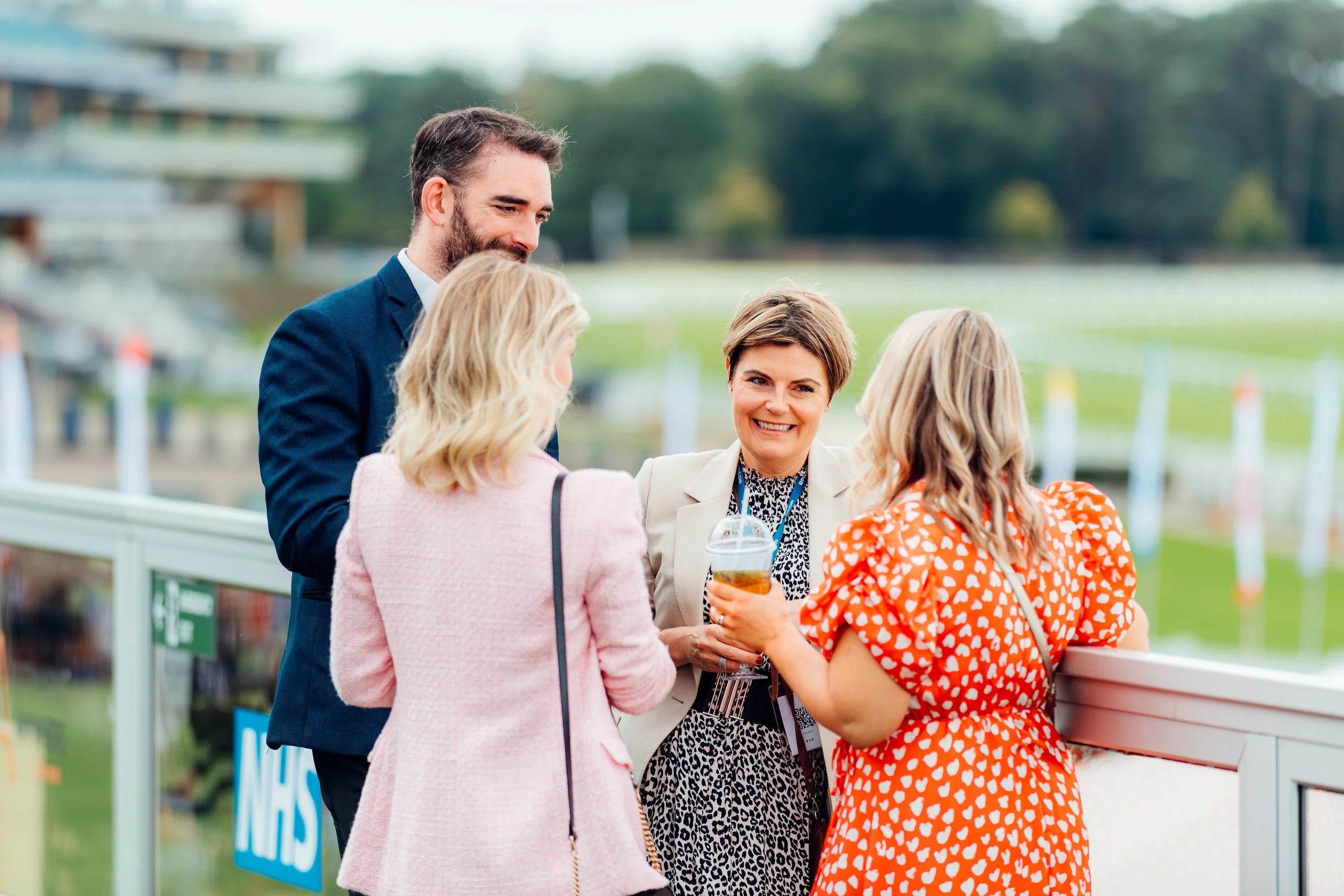 Corporate guests mingling over drinks at The ERP Today Awards & Fundraiser at Ascot Racecourse. Candid charity gala and hospitality photography by Will Bailey.