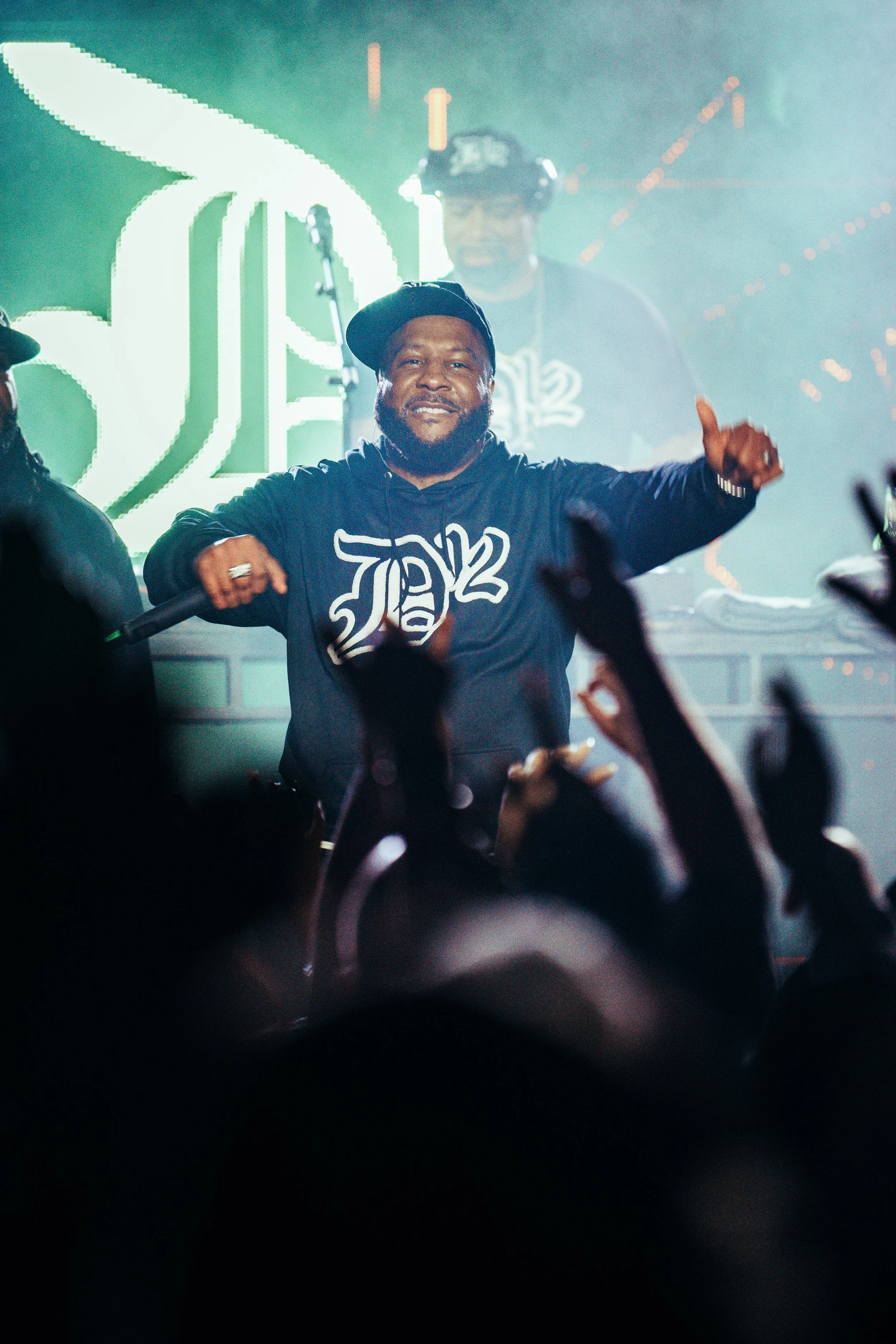 Legendary hip-hop group D12 performing live on stage and interacting with a hyped crowd at a premier live stage in Southampton, Hampshire. Iconic international rap tour documentary and energetic live performance photography by Will Bailey.