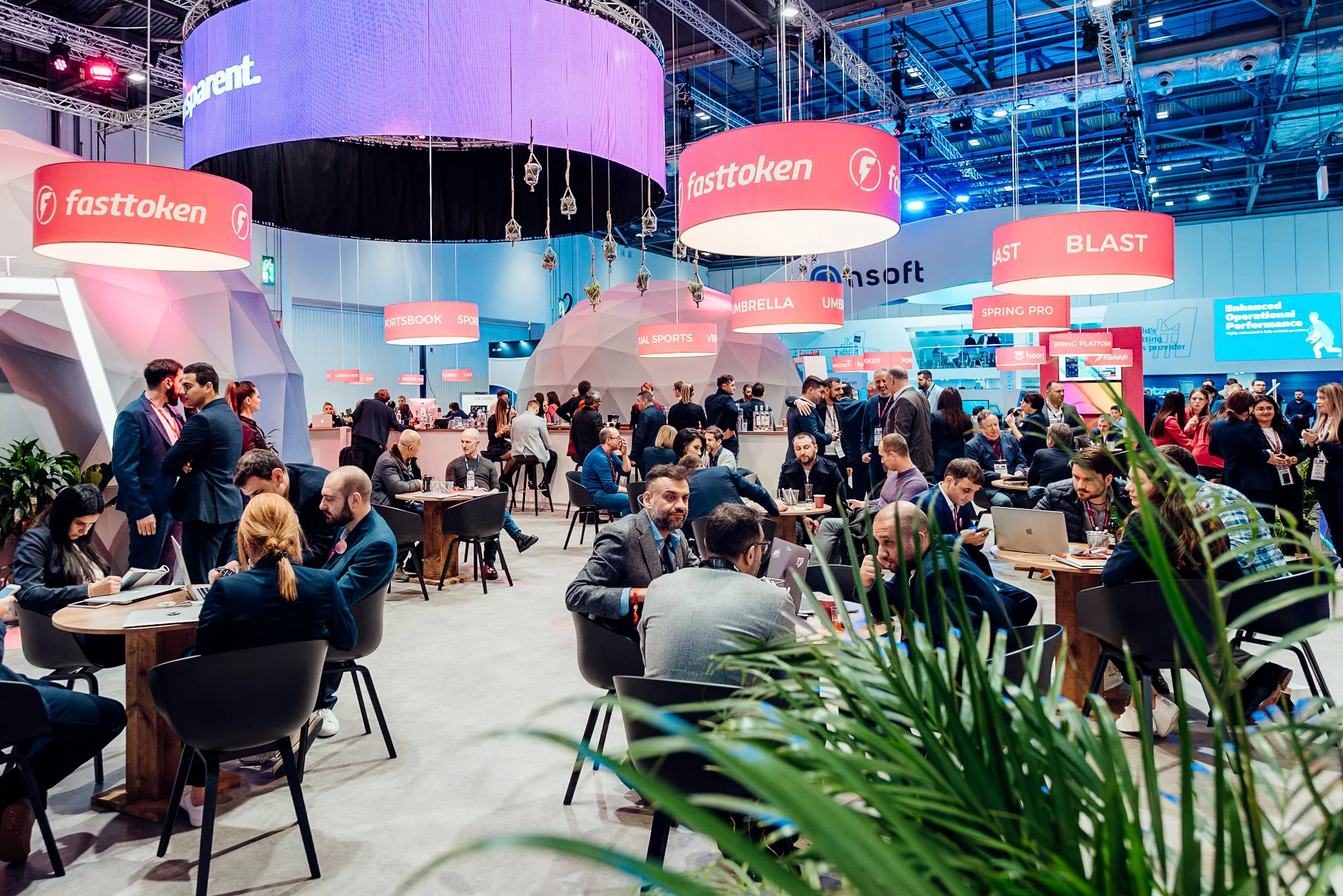 Corporate networking and brand exhibitions at the ICE London expo, hosted at the ExCeL Centre. Professional corporate event photography by Will Bailey.