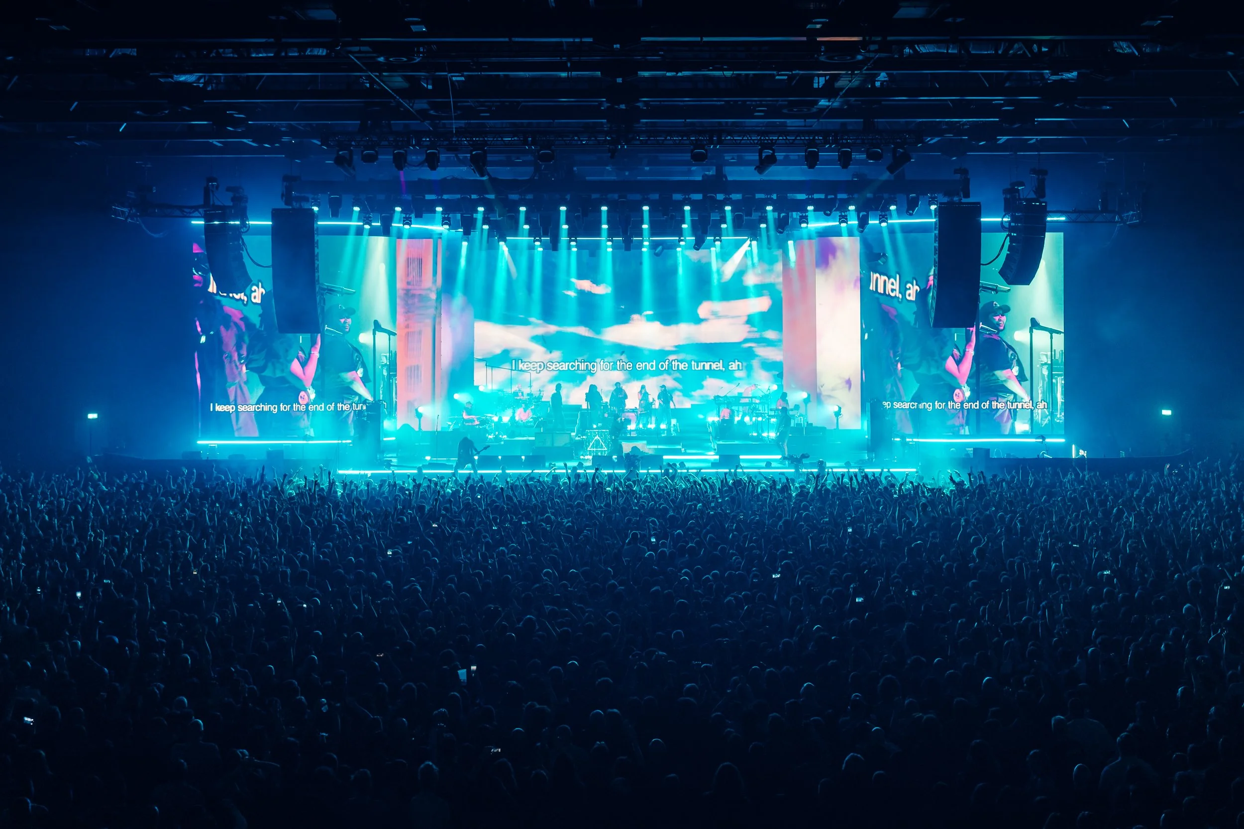 A sweeping wide arena perspective of Gorillaz performing live on a massive production stage to a sold-out crowd at the Utilita Arena Cardiff. Large-scale arena tour and premium alternative rock concert photography by Will Bailey.