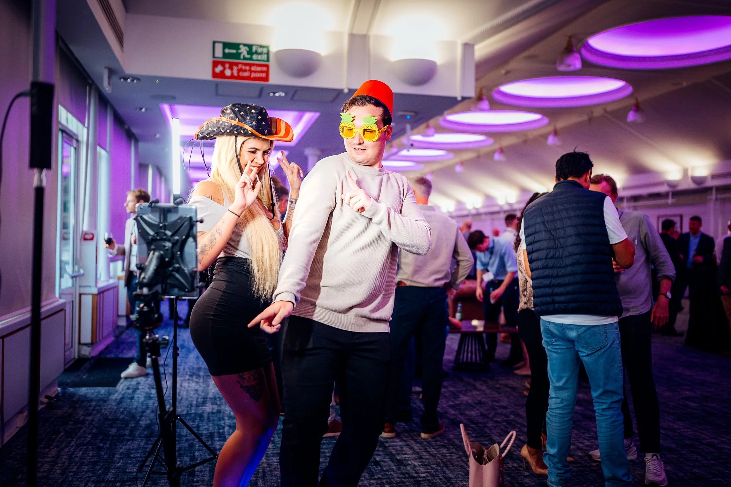 Guests enjoying an interactive 360 photo booth activation during the evening gala entertainment at the Midwich Tech Xpo, Ascot. Experiential corporate event photography by Will Bailey.