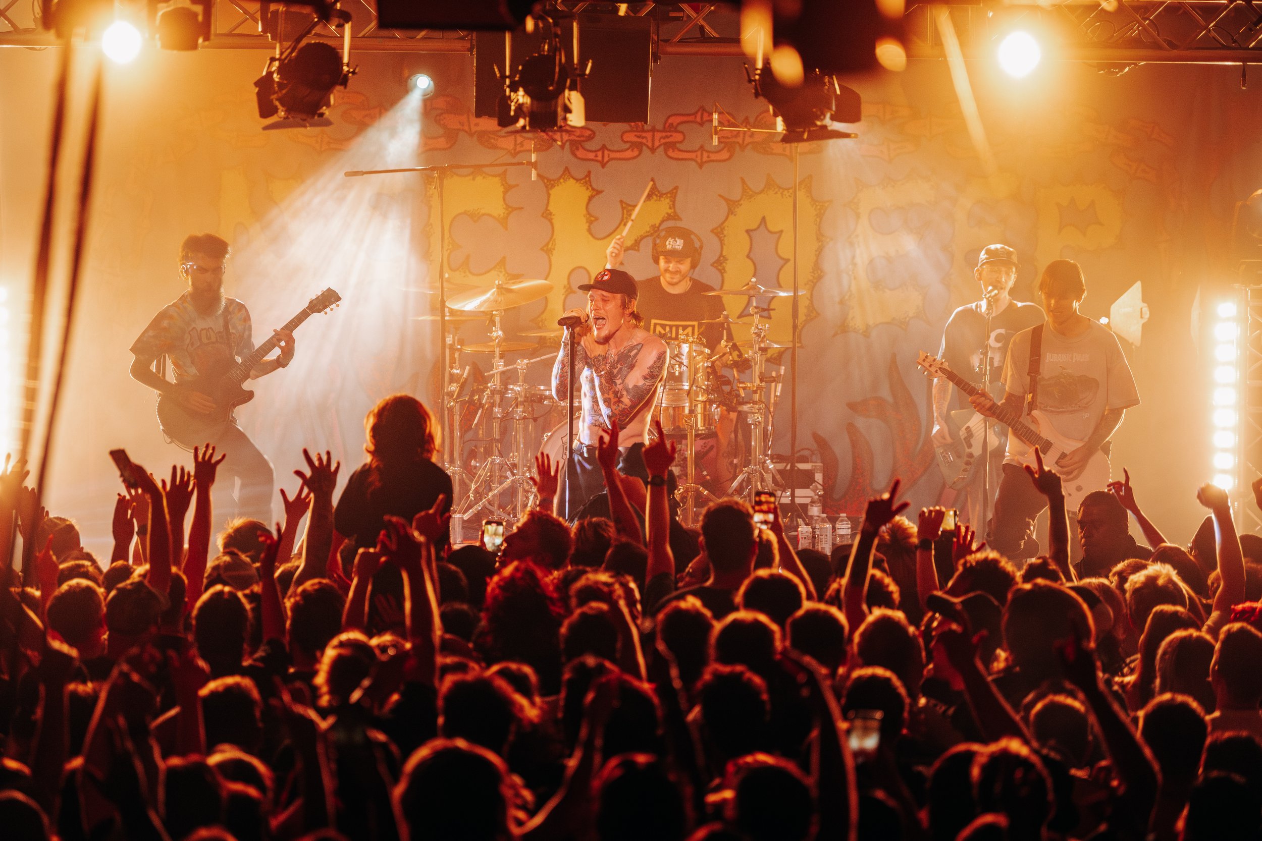 Welsh pop-punk band Neck Deep performing a high-velocity live set surrounded by dramatic concert beams at a popular independent music venue in Southampton, Hampshire. Professional live band promotion and touring artist photography by Will Bailey.