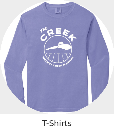 Light blue long sleeve T-shirt with a white circular logo featuring a creek and mountains, and text reading 'The Creek Village Walnut Creek Alaska'.