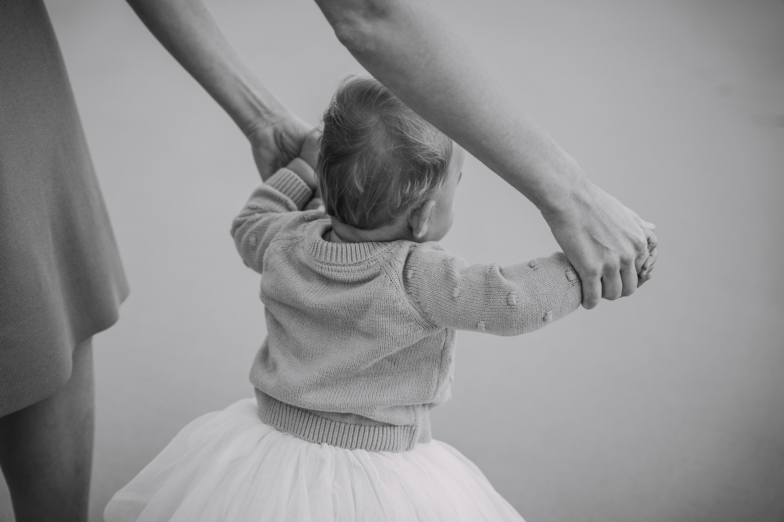 Child walking with support of an adult