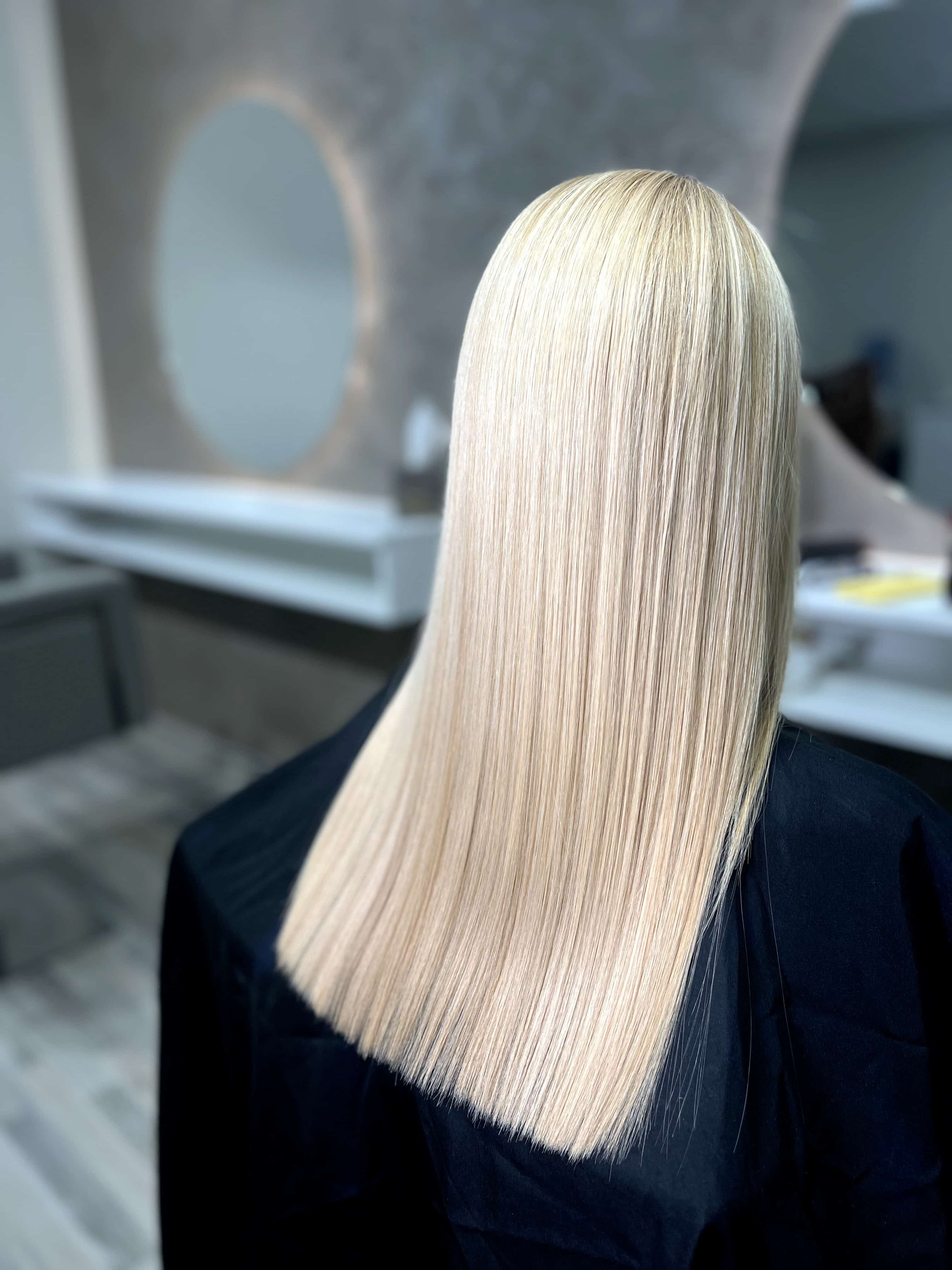 Platinum blonde hair with healthy texture after nanoplasty treatment