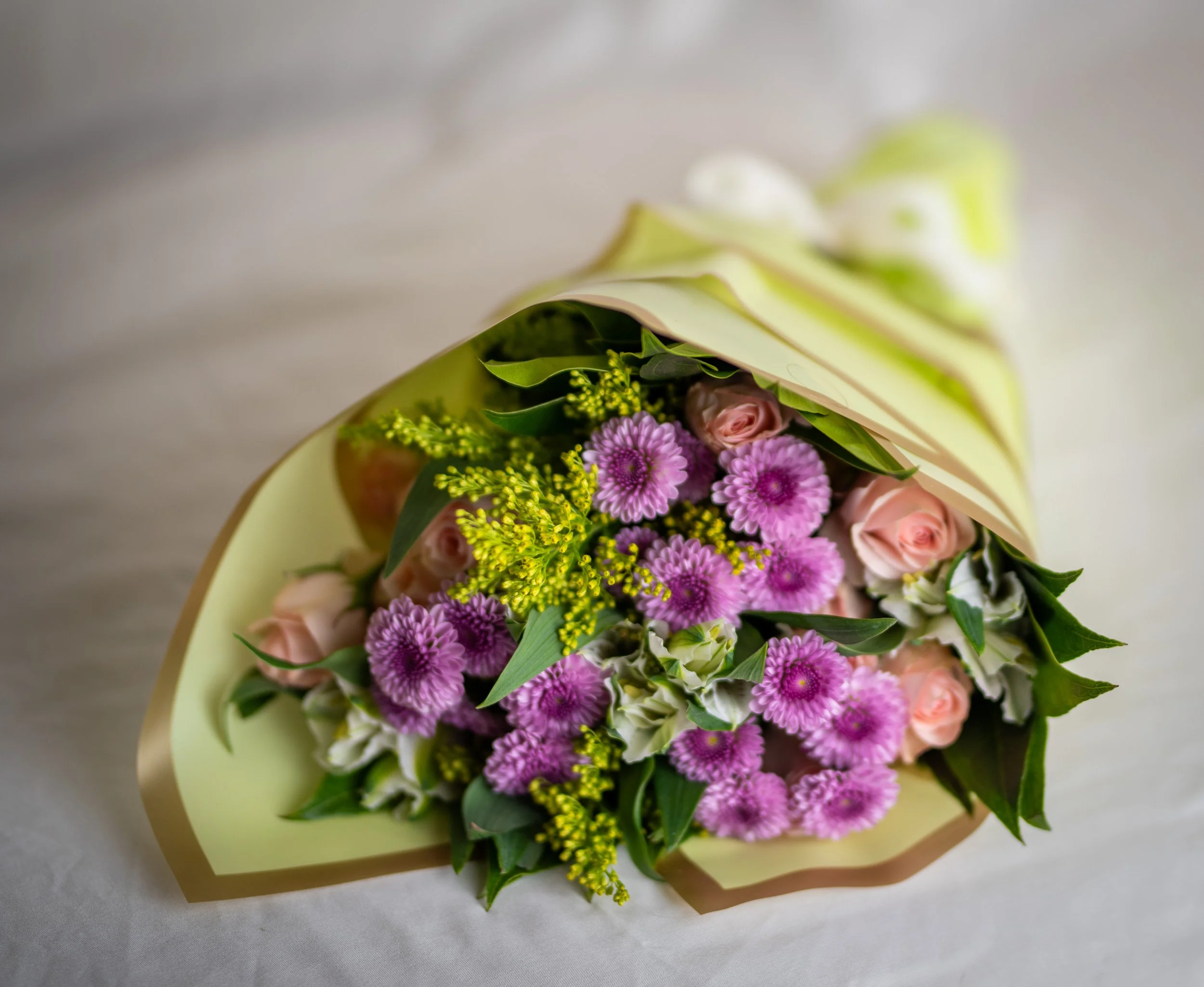 wrapped bouquet green top.jpg