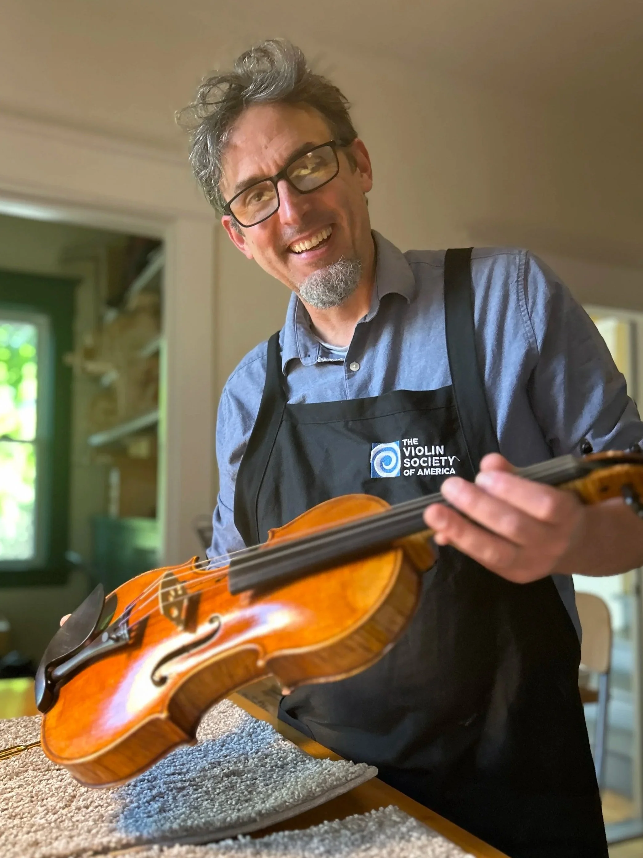 Peter Bingen, an award-winning master violin maker, in his St. Paul workshop.