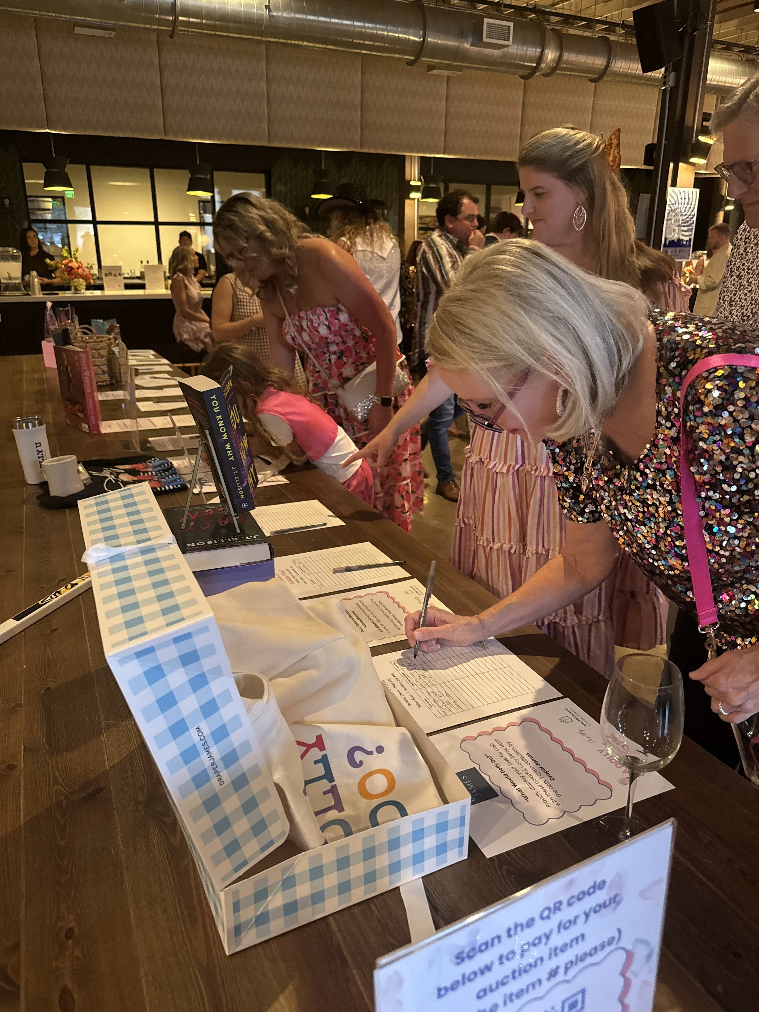 Guests participating in silent auction