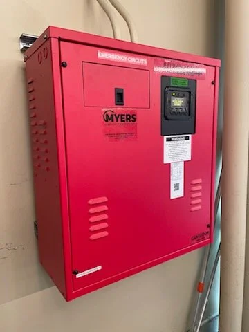 Commercial emergency lighting inverter installation providing reliable backup power solutions for life safety and emergency circuits.