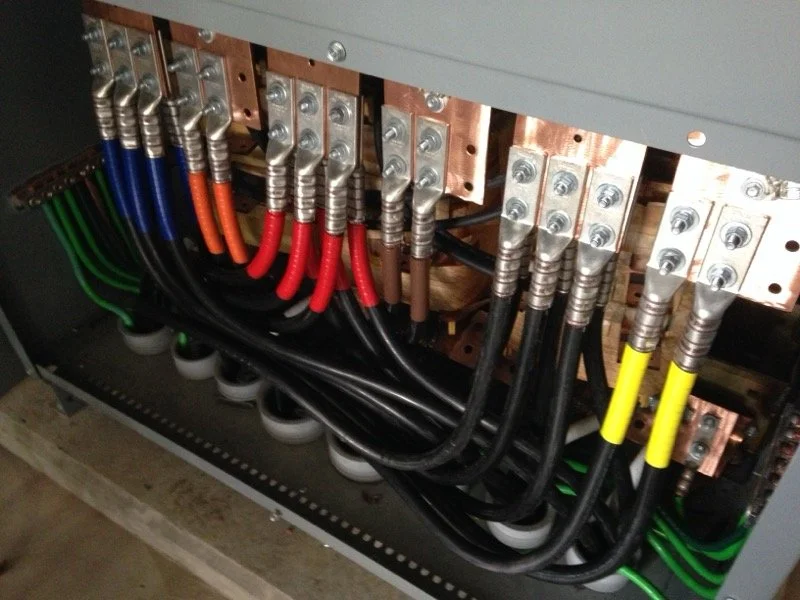 Detailed high-capacity electrical busbar installation with professionally terminated conductors engineered for safe and efficient power distribution.