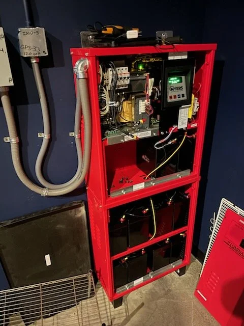 Custom-installed emergency backup power system featuring battery storage, control components, and automatic transfer equipment designed for reliable standby power performance.
