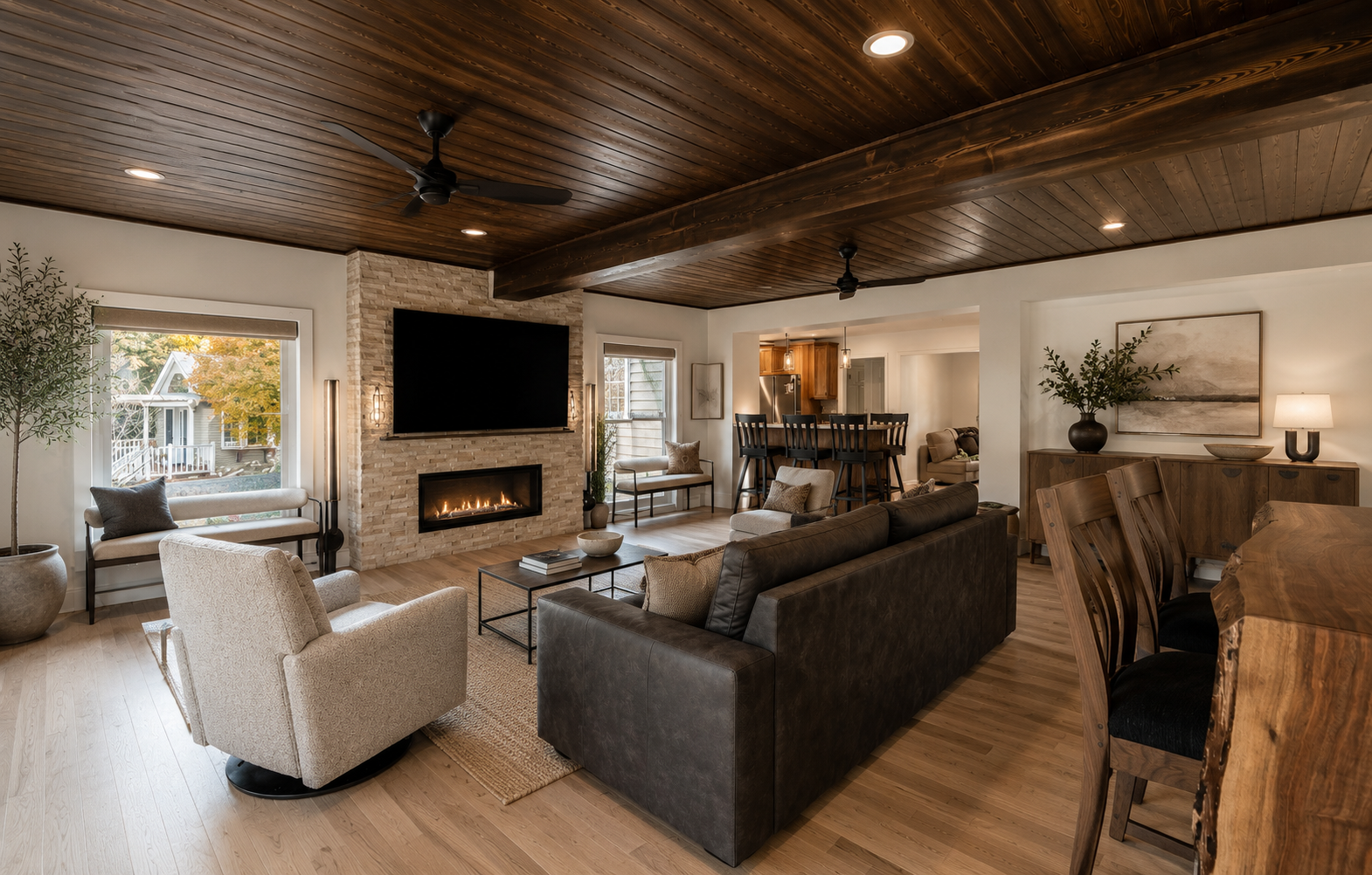 Updated basement with wooden ceiling and a stone fireplace