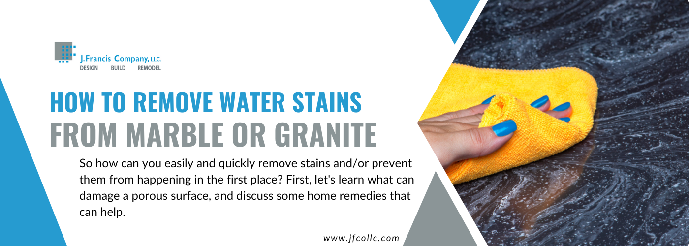 Image of a hand wiping a granite countertop