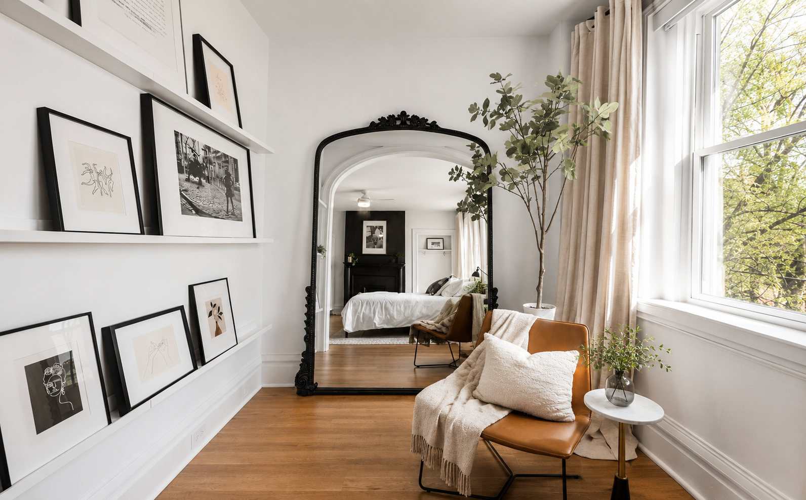 Vintage-style mirror with a reflection of a bedroom