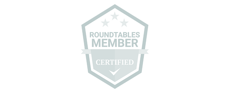 A badge with a pentagon shape displaying 'Roundtables Member,' and 'Certified' with checkmark beneath, surrounded by stars.
