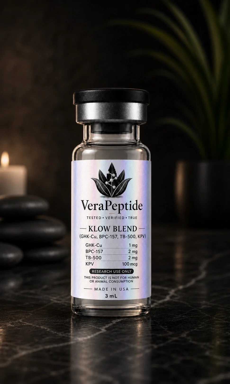 A small clear glass vial with a black cap, labeled 'VeraPeptide KLOW BLEND,' containing a liquid supplement or research chemical. The label indicates it includes GHK-Cu, BPC-157, TB-500, and KPV, with specific dosages. The vial is positioned on a dark surface with a background that includes stacked stones, candles, and plants.