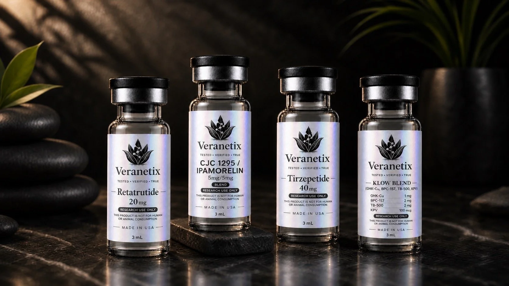 Four small bottles of Veranetix supplements on a dark wooden surface, with black stones and green plants in the background.