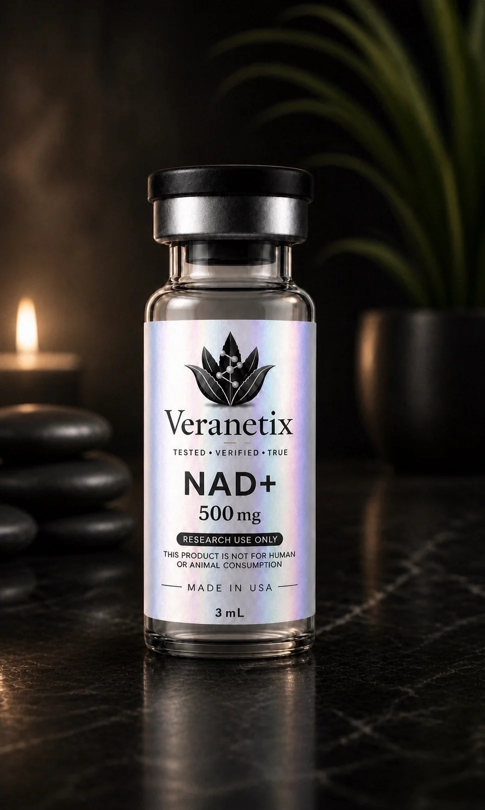 A small clear glass vial with a black cap, labeled Veranetix NAD+ 500 mg, placed on a dark surface with stones and a plant in the background, and a candle to the side.