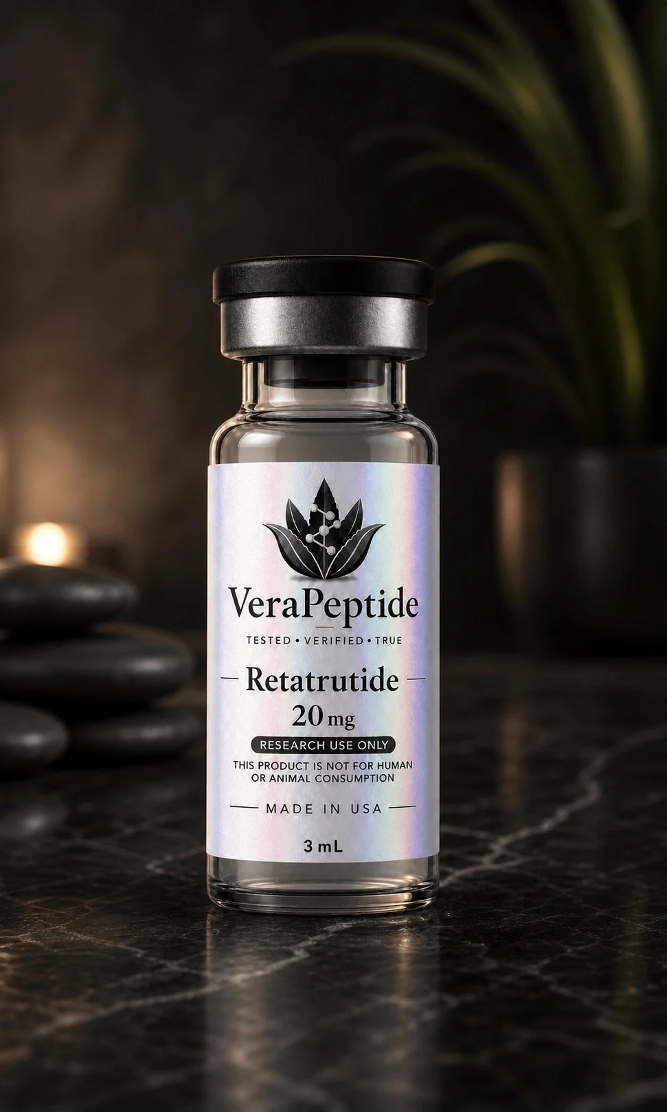 A small glass vial labeled 'VeraPeptide Retatrutide 20 mg' placed on a dark marble surface surrounded by smooth black stones, with a background of dark textured walls and foliage.