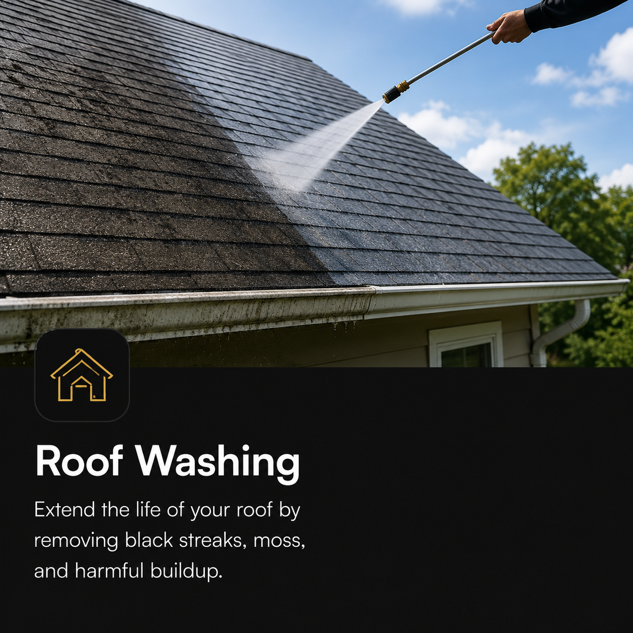 Person using a pressure washer to clean a sloped house roof with shingles.