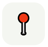 Red and black game controller button on a gray background