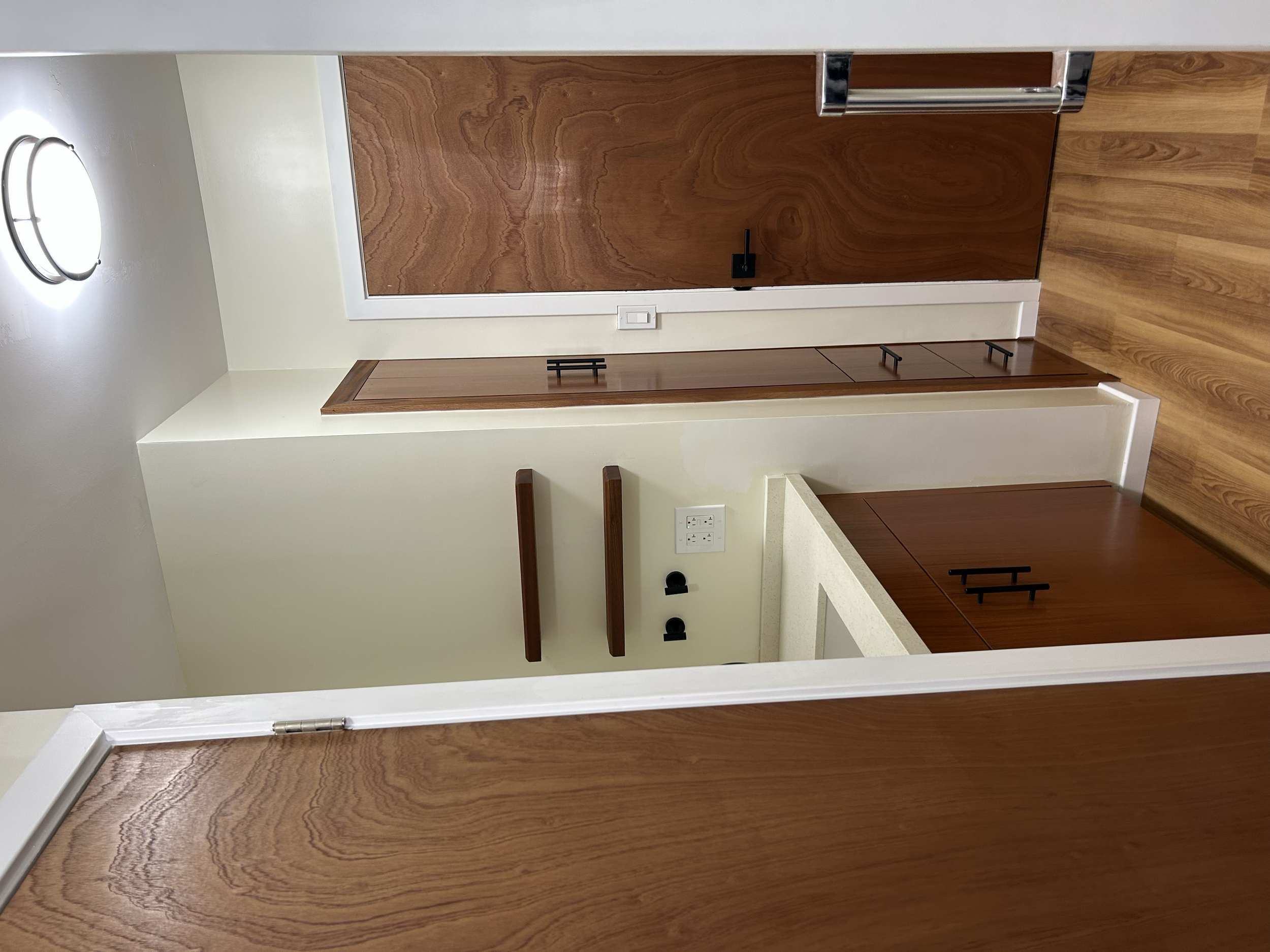 Custom Cabinetry & Interior Doors
Clean lines, natural wood tones, and custom craftsmanship come together in this beautifully finished space. Featuring custom cabinetry, floating shelves, and matching wood doors, each piece was built to create a warm