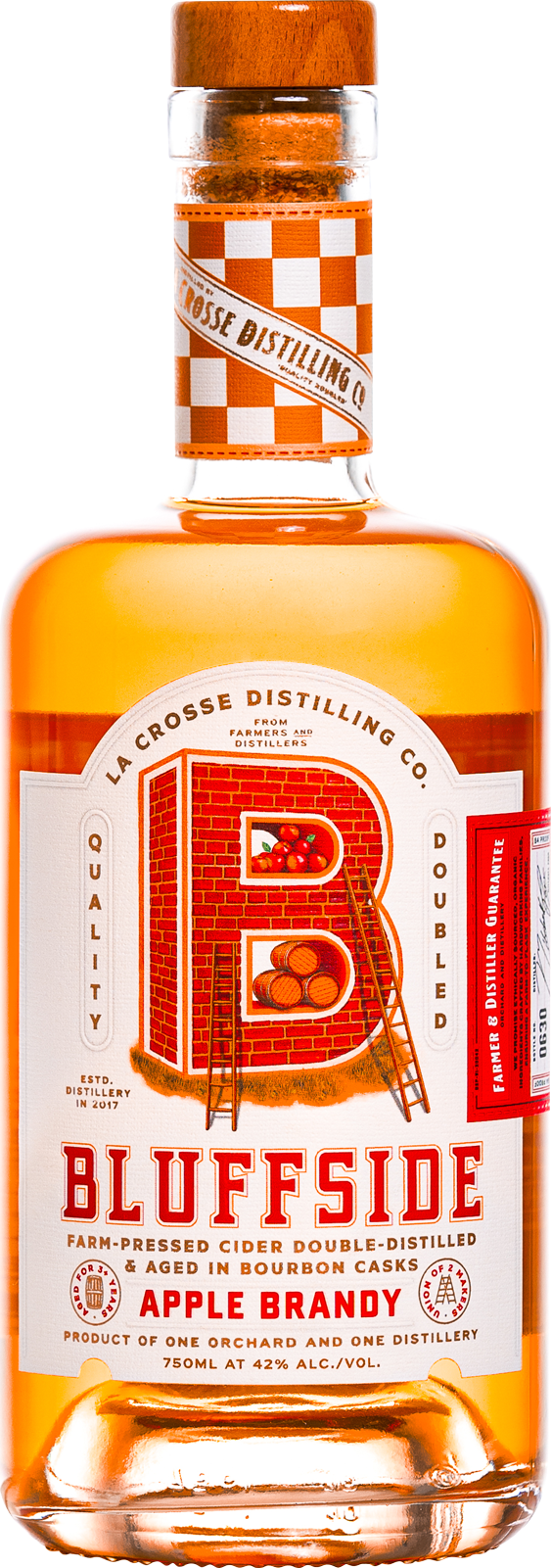 Bottle of Bluffside apple brandy with orange and white label and checkered pattern on neck