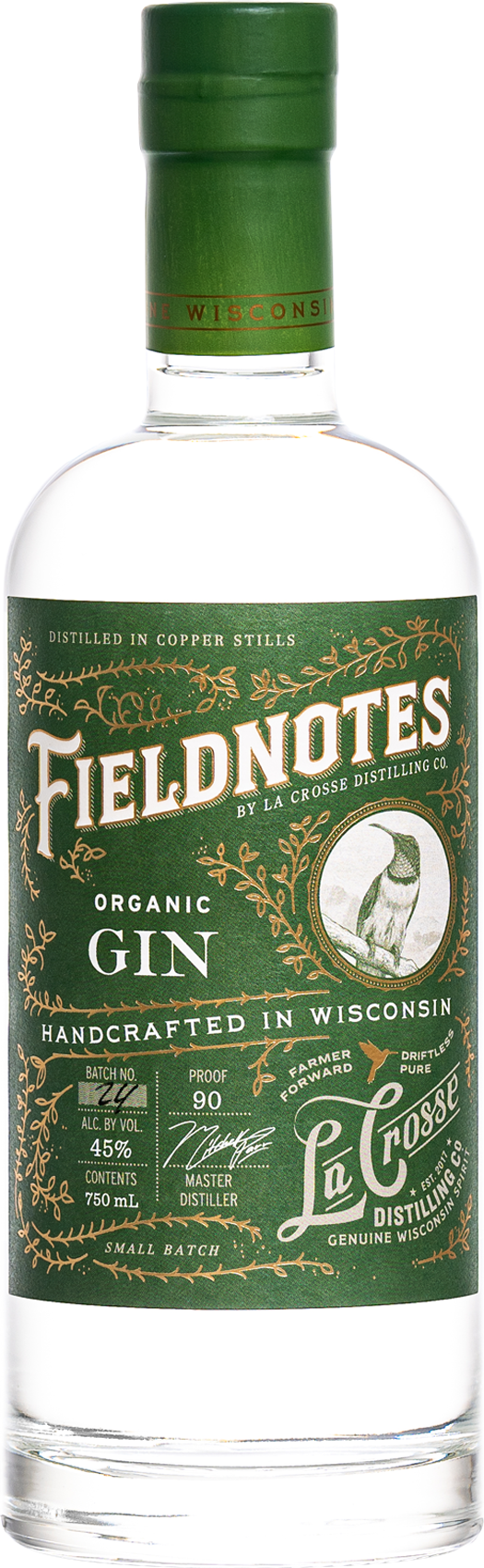 A clear glass bottle of Fieldnotes organic gin with a green label and cap, featuring gold and white text and a hummingbird illustration.