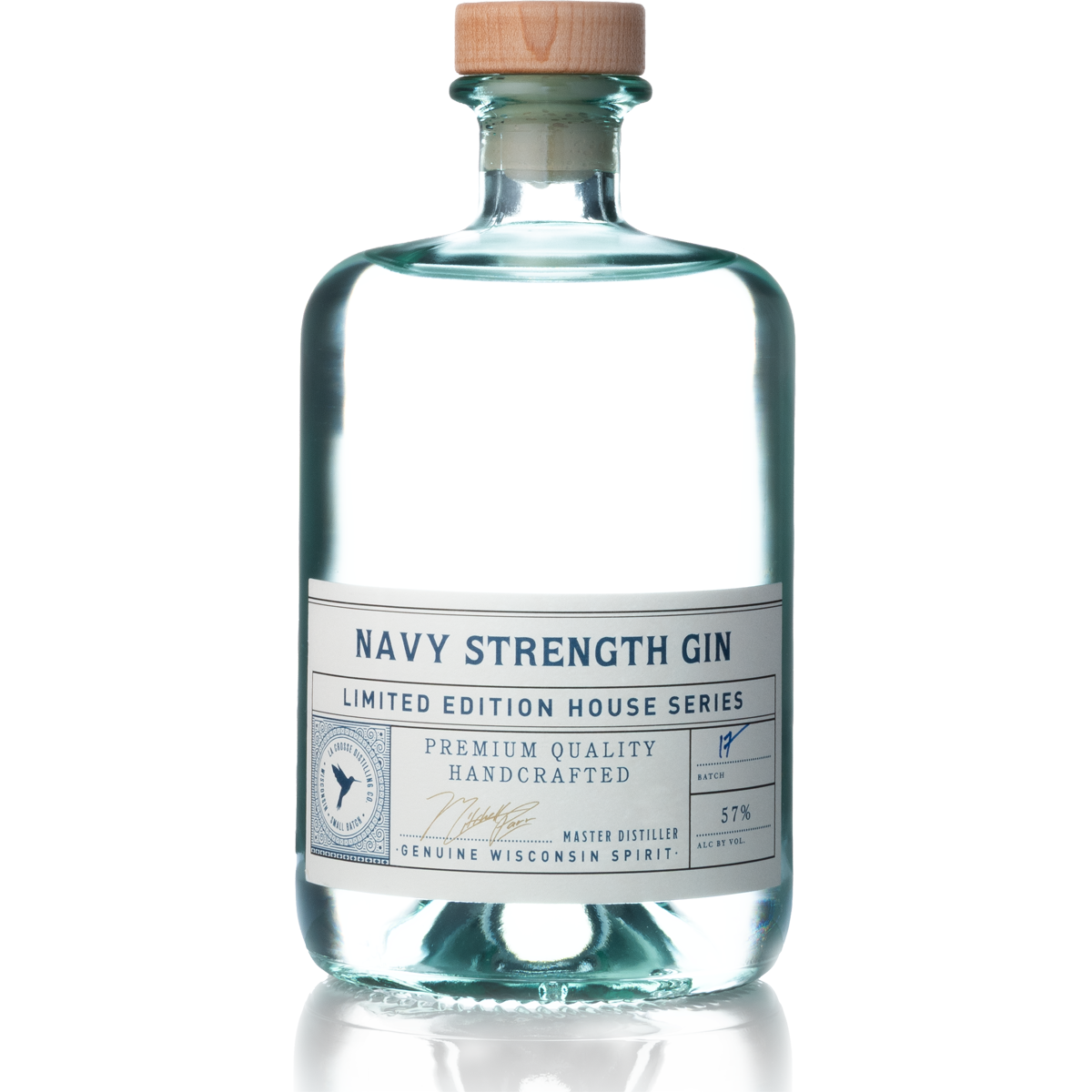 A clear glass bottle labeled 'Navy Strength Gin' with a wooden cork, part of the Limited Edition House Series, with a white label that includes details about craftsmanship, alcohol content, and distillery origin.