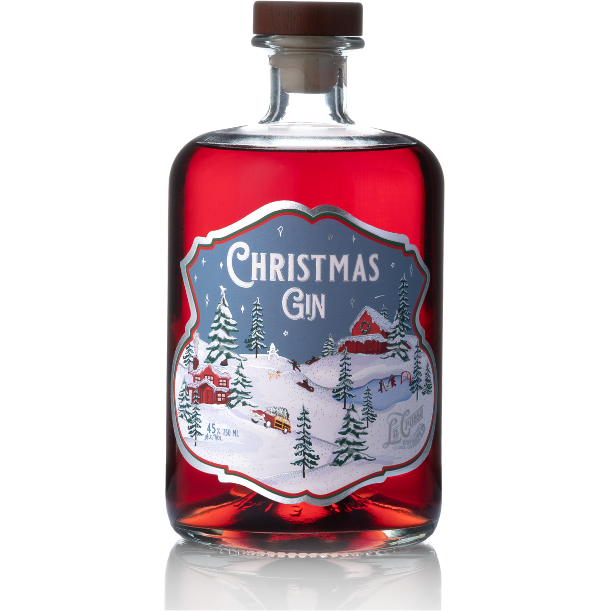 Bottle of Christmas Gin with a winter snowy landscape illustrated on the label, featuring trees, a barn, and a sleigh.