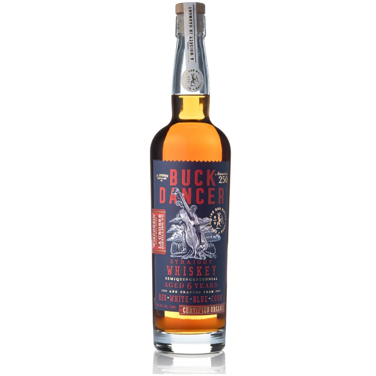 A bottle of Buck Dancer straight whiskey aged 6 years, with a blue and red label, featuring an illustration of a tree with a guitar in front, and gold accents, plastic cap with seal.