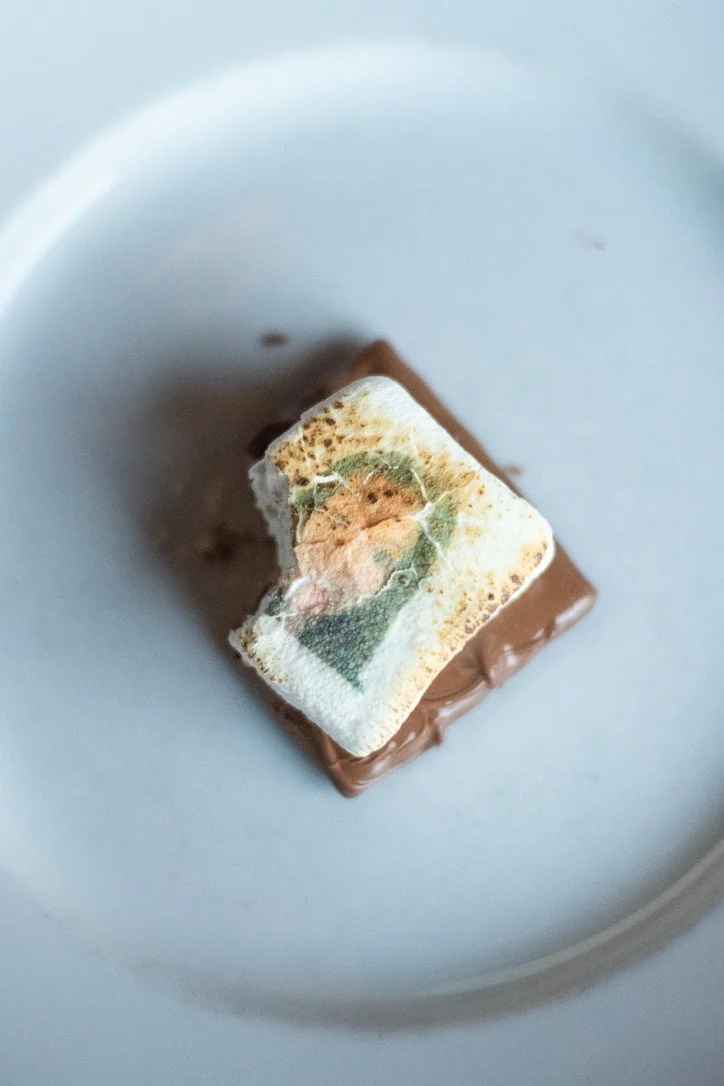 A partly eaten personalized s'more