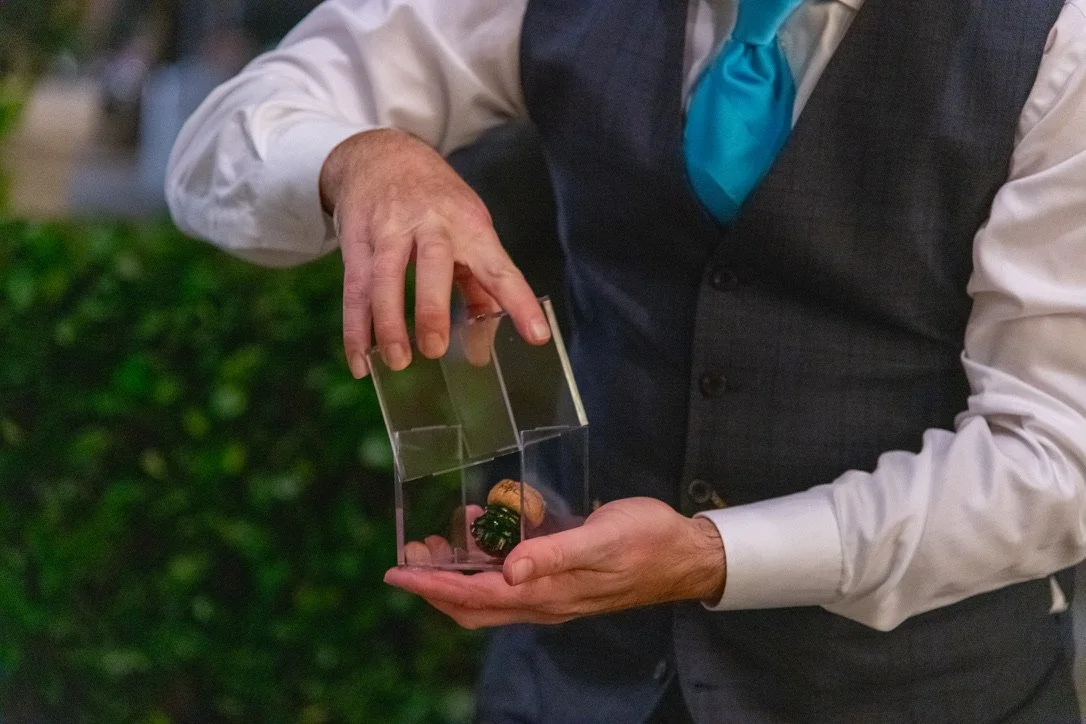 Me, placing the result of sabering into a display case for a souvenir.