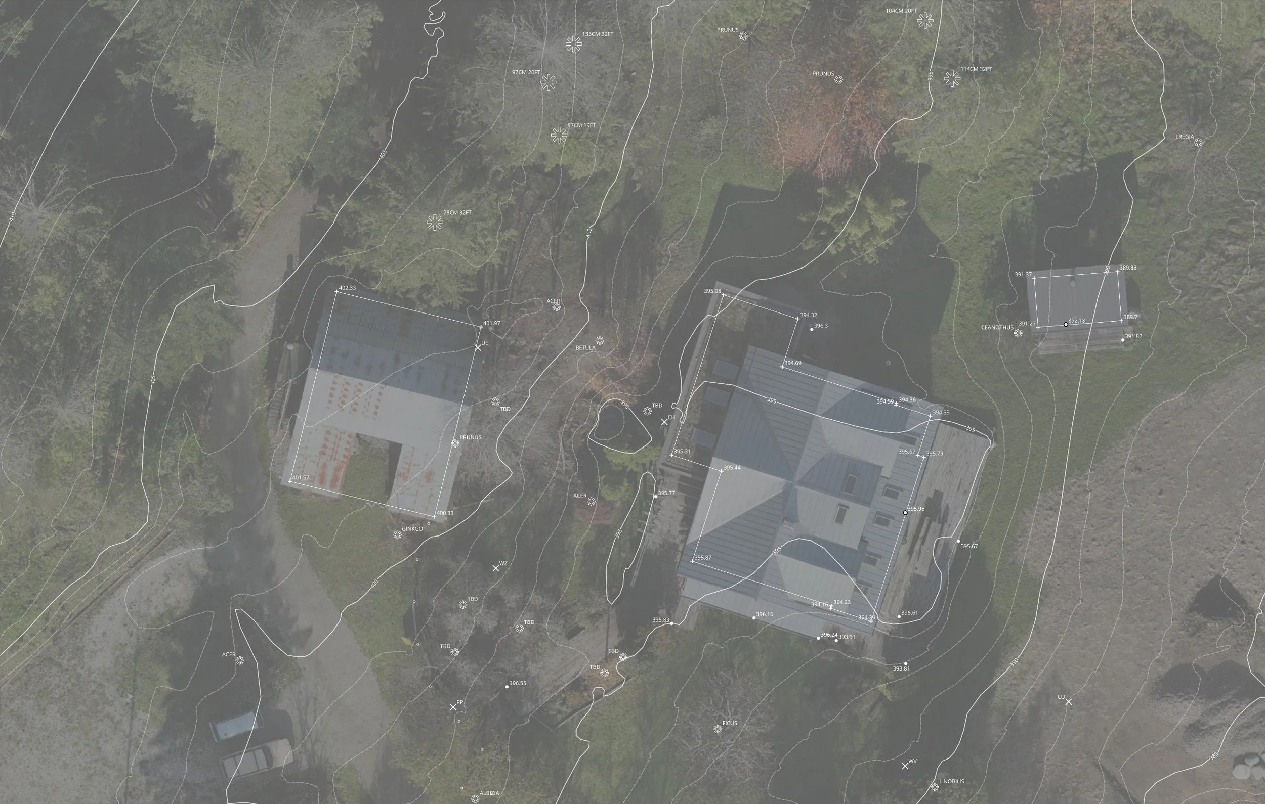 An overhead view of a property with a house, surrounding trees, a lawn, and a driveway, overlaid with a topographic map including contour lines, elevation markers, and site details.