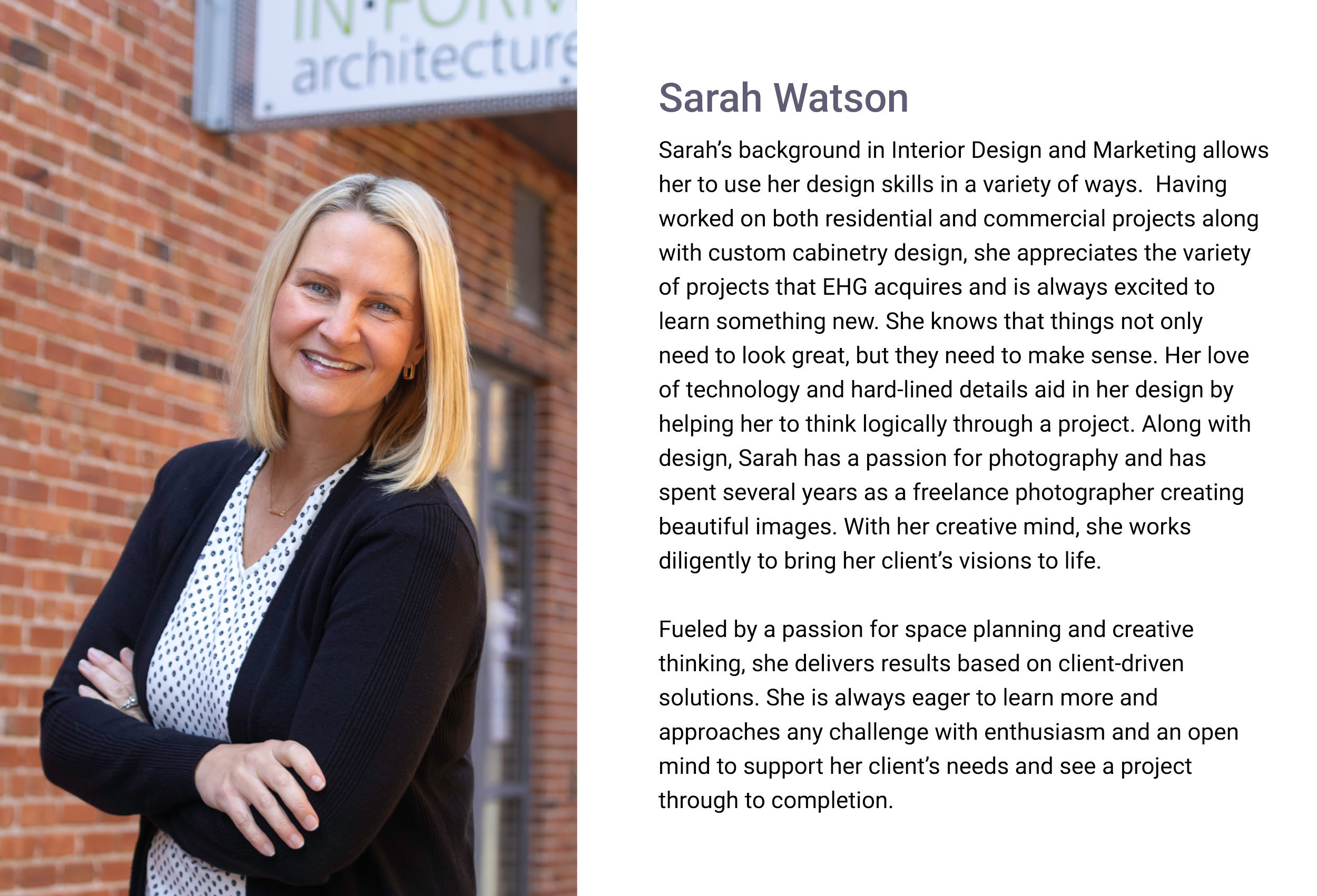 Sarah Watson, Interior Designer of E.H. Goodman. A professional woman with blonde hair, wearing a black blazer and a white blouse with black polka dots, stands in front of a brick building. She is smiling, with her arms crossed.