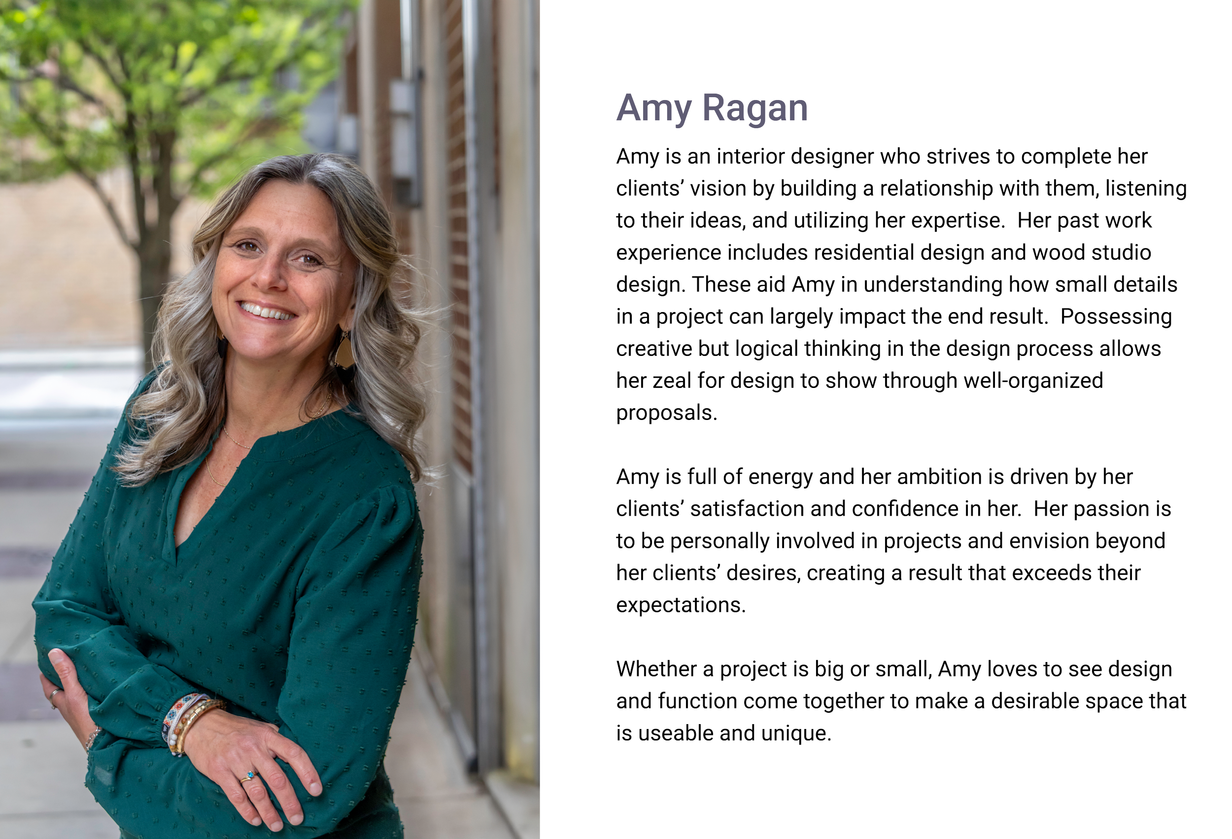 Amy Ragan, Interior Designer of E.H. Goodman Architects. Portrait of a smiling woman with long wavy blonde hair, wearing a teal top, standing outdoors near a brick building and a tree with green leaves.
