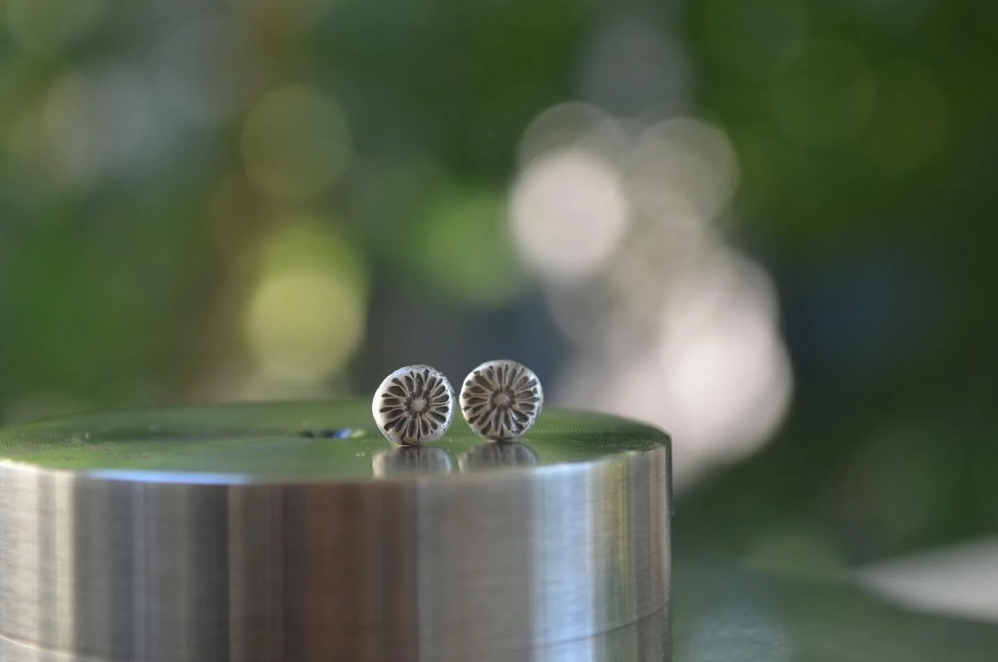 Tiny sunflower studs for everyday wear.