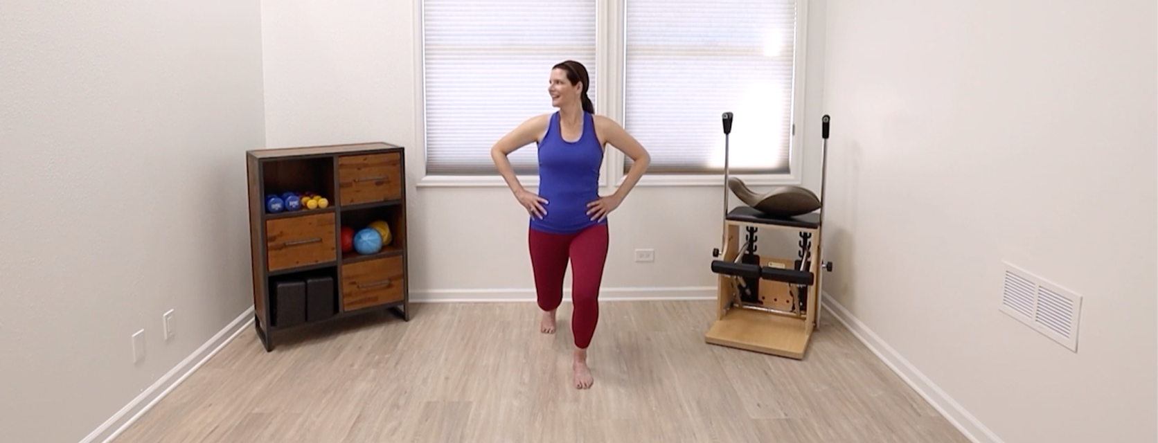 An image of Ashley Taylor, from one of the Taylor Pilates & Fitness online Pilates online Mat classes showing a Pilates Mat exercise.