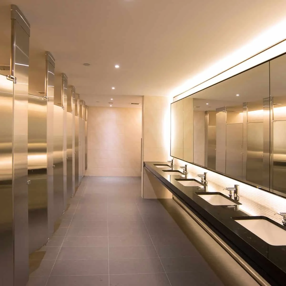 bathroom stalls and sinks in an office bathroom