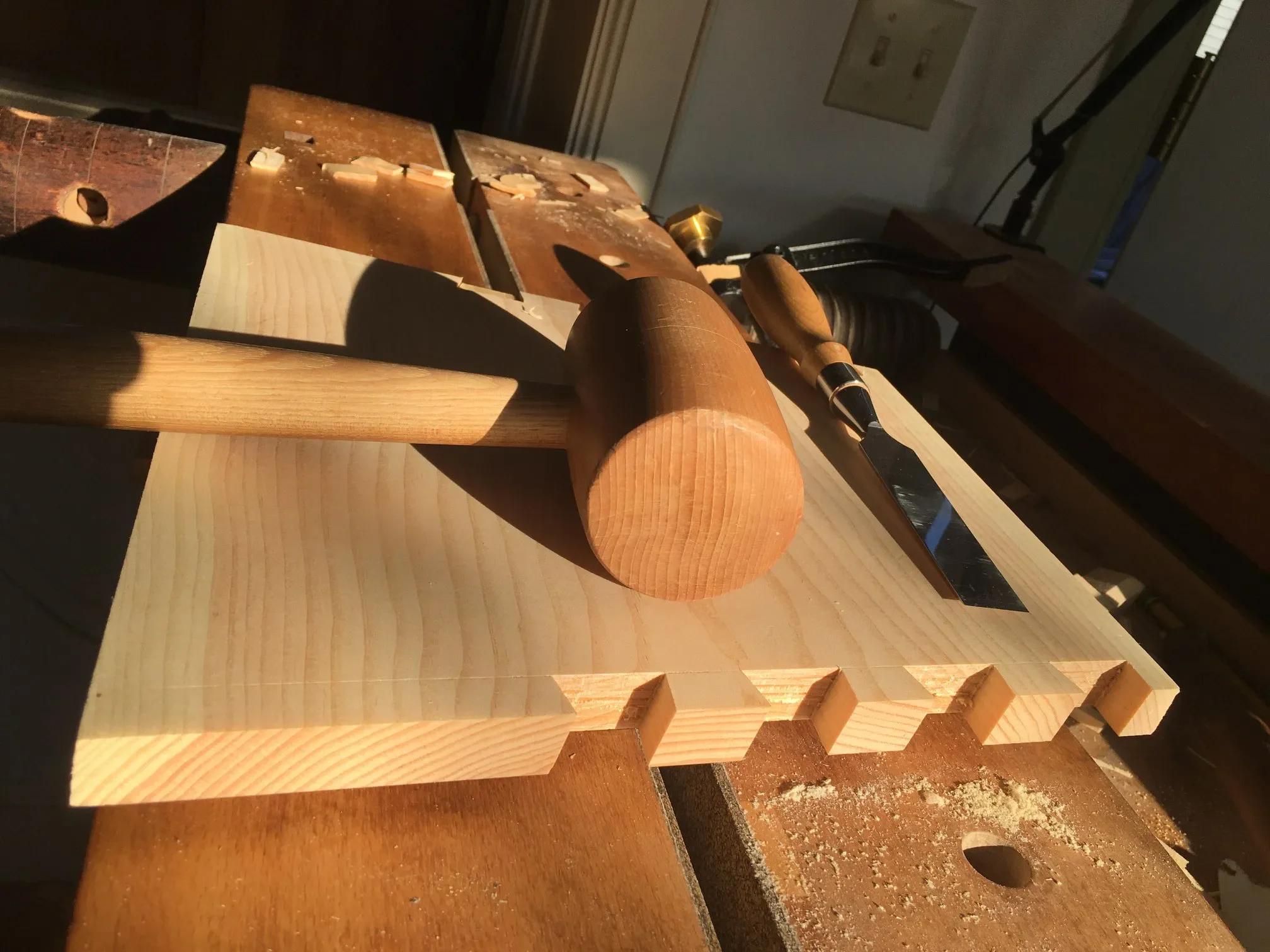 A mallet and woodworking in process