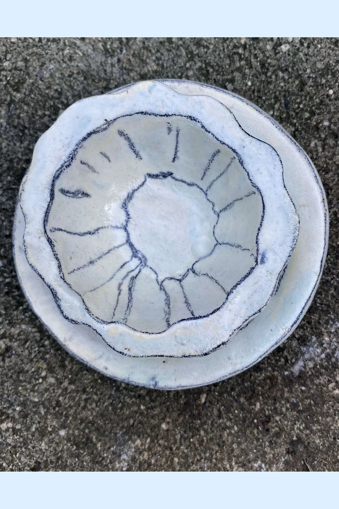 Johanna Jackson, Very Small Bowl and Saucer. Scalloped porcelain, drawn on in light multicolor. 2¼" tall, 4½" wide.