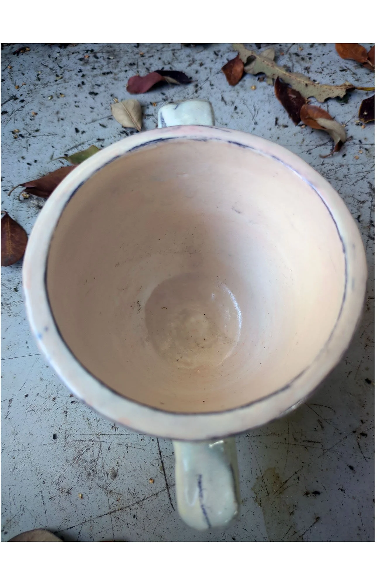Looking down into Johanna Jackson ceramic cup, plain pale pink interior with outlined rimline